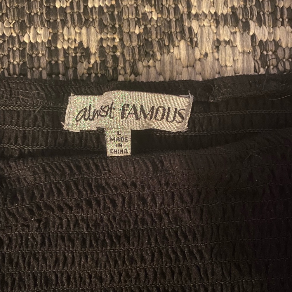brand: ALMOST FAMOUS | color: BLACK AND WHITE | size: LARGE